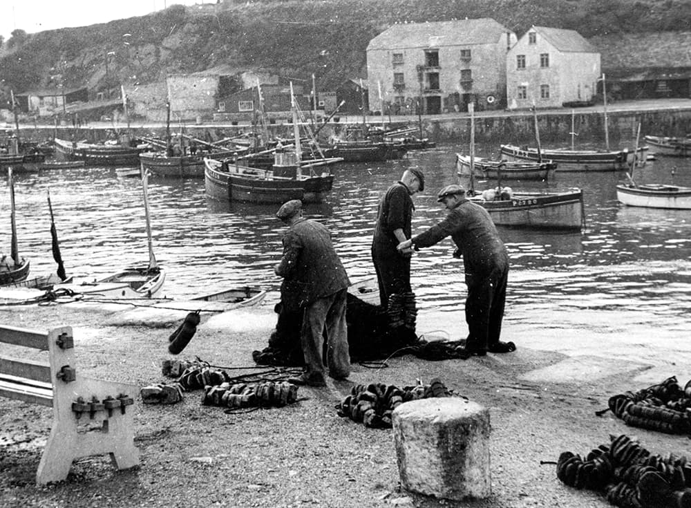 Fishermen stood aside the sea, preparing to fish